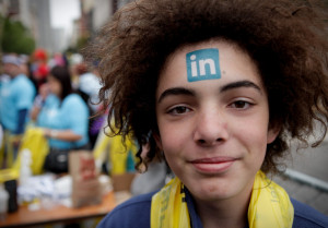 A Linkedin temporary tattoo decorates the forehead of Baptiste Vauthey at the 2010 Bay to Breakers race in San Francisco. Vauthey's father works for the company.