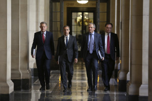 Left to right, Spencer Dale, executive director for financial stability at the Bank of England, Mark Carney, governor of the Bank of England, Jon Cunliffe, deputy governor for financial stability at the Bank of England, and Andrew Bailey, deputy governor for prudential regulation at the Bank of England and chief executive officer of the Prudential Regulation Authority (PRA), walk inside the bank before attending the bank's financial stability report news conference at the Bank of England in London, U.K., on Thursday, June 26, 2014. Carney waded into Britain's property market today, limiting the number of riskier mortgages to prevent an unsustainable buildup of consumer debt derailing the economic recovery. Photographer: Chris Ratcliffe/Bloomberg *** Local Caption *** Mark Carney; Spencer Dale, Jon Cunliffe; Andrew Bailey