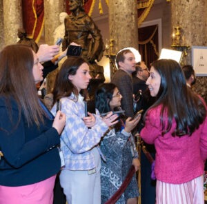 Reporter, Lauren Green, recording an interview inside the Capitol building.